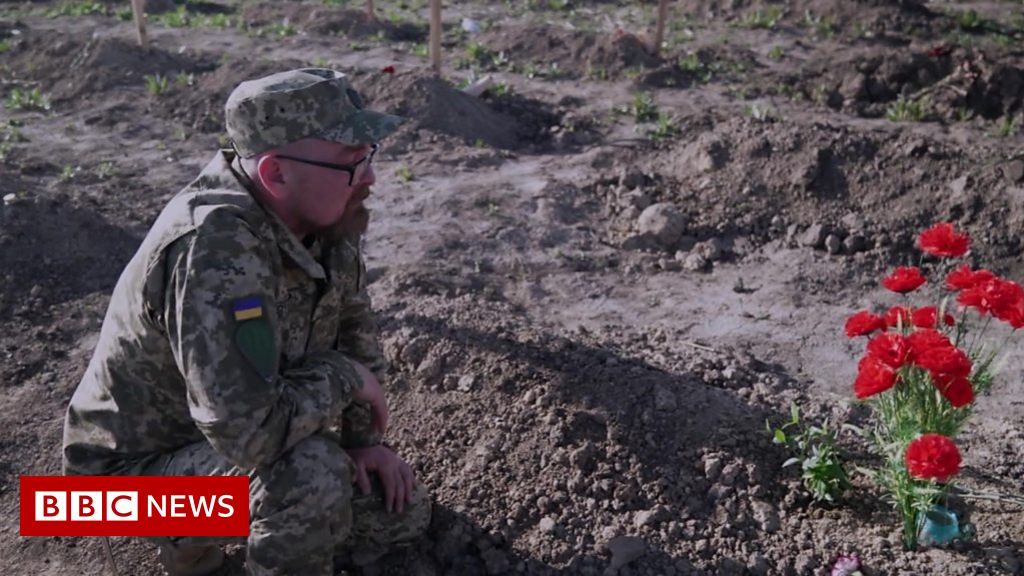 Ukraine war: Soldier weeps at comrade's graveside